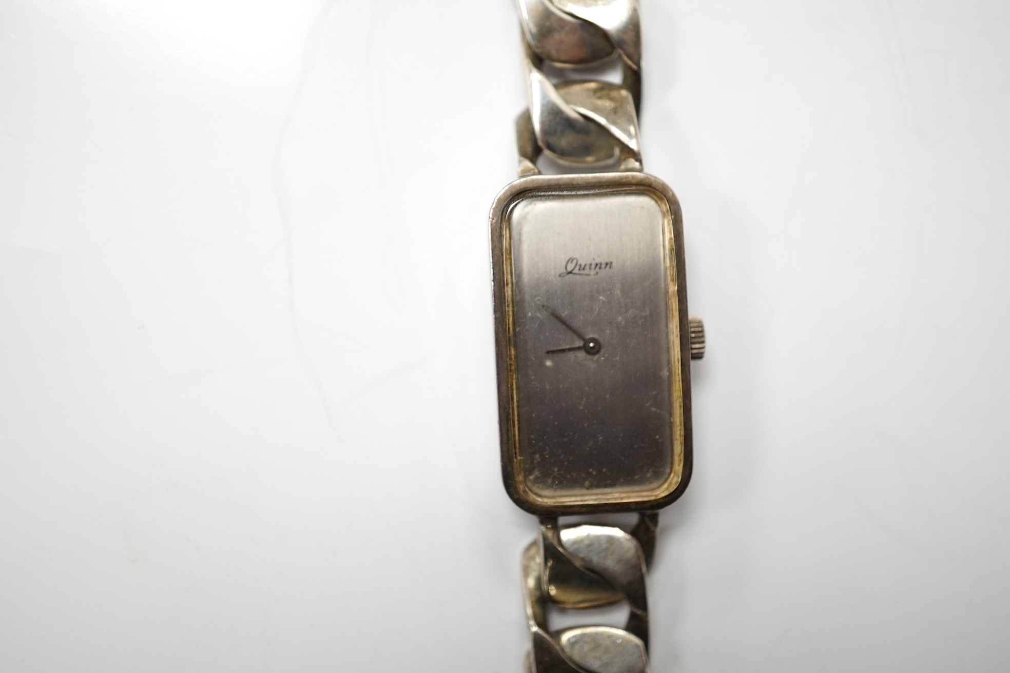 A lady's modern 925 Quinn wrist watch, with heavy silver curb link bracelet and two other wrist watches including a Smiths Empire. Condition - poor to fair